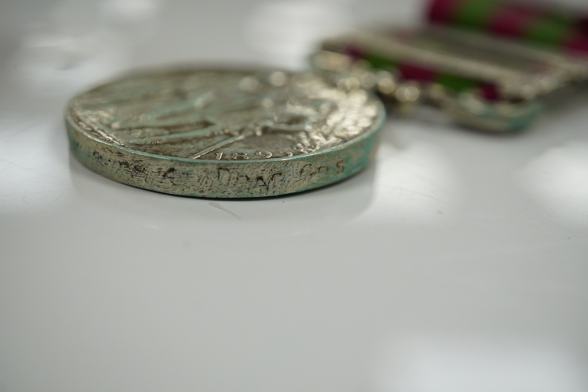 Two India Medals; one with Punjab Frontier 1897-98 and Relief of Chitral 1895 clasps, the other Tirah 1897-98 and Punjab Frontier 1897-98, both with naming erased.